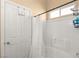 Clean bathroom with shower/tub combo and white tile at 8437 Sluman Ct, Las Vegas, NV 89128