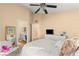 Spacious bedroom with large window and ceiling fan at 8437 Sluman Ct, Las Vegas, NV 89128