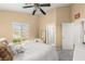 Bright bedroom with a comfortable bed and plenty of natural light at 8437 Sluman Ct, Las Vegas, NV 89128