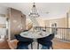 Elegant dining area with marble table and chandelier at 8437 Sluman Ct, Las Vegas, NV 89128