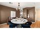 Elegant dining room featuring a marble table and modern chandelier at 8437 Sluman Ct, Las Vegas, NV 89128