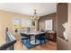 Bright dining room features a modern chandelier and seating for four at 8437 Sluman Ct, Las Vegas, NV 89128