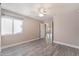 Bedroom featuring a ceiling fan, closet, window with natural light, and wood-look flooring at 8617 Prairie Hill Dr, Las Vegas, NV 89134