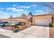 Inviting one-story townhome with manicured landscape, attached one-car garage, under a bright blue sky at 8617 Prairie Hill Dr, Las Vegas, NV 89134