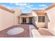 Inviting front entrance features desert landscaping, a secure gate, and a charming tiled porch at 8617 Prairie Hill Dr, Las Vegas, NV 89134