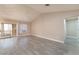 Spacious living room with wood-look flooring, slider doors and vaulted ceiling at 8617 Prairie Hill Dr, Las Vegas, NV 89134