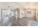 Bright and airy living room showcasing wood-look flooring, vaulted ceiling and open layout at 8617 Prairie Hill Dr, Las Vegas, NV 89134