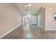 Open living room showcasing wood-look flooring, neutral paint colors, and vaulted ceiling at 8617 Prairie Hill Dr, Las Vegas, NV 89134