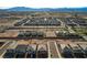 Aerial view of a large community of houses with mountain views in the background at 8749 Black Cordon Rd, Las Vegas, NV 89139