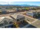 Aerial view of a two-story house with a modern design and a mountain background at 8749 Black Cordon Rd, Las Vegas, NV 89139