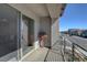 Balcony with modern railings offers neighborhood street views and natural light to the adjacent living area at 8749 Black Cordon Rd, Las Vegas, NV 89139