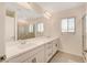 Bathroom with double vanity and large mirror at 8749 Black Cordon Rd, Las Vegas, NV 89139