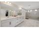 Elegant bathroom with double vanity, large mirror, and a spacious shower at 8749 Black Cordon Rd, Las Vegas, NV 89139