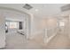Open hallway leads to bedroom, featuring plush carpeting and a modern railing system, enhancing the home's flow at 8749 Black Cordon Rd, Las Vegas, NV 89139