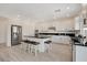 Eat-in kitchen with an island, stainless steel appliances and sleek design at 8749 Black Cordon Rd, Las Vegas, NV 89139