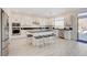 Open kitchen featuring an island, stainless steel appliances, and dark countertops at 8749 Black Cordon Rd, Las Vegas, NV 89139