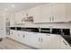 White shaker cabinets, granite countertops, and stainless steel appliances in this kitchen at 8749 Black Cordon Rd, Las Vegas, NV 89139