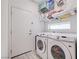 Laundry room with washer, dryer and shelving at 8749 Black Cordon Rd, Las Vegas, NV 89139