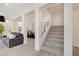 Open concept living area featuring stairs, kitchen and living room space at 8749 Black Cordon Rd, Las Vegas, NV 89139
