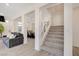 Modern staircase with gray carpeting and open risers at 8749 Black Cordon Rd, Las Vegas, NV 89139