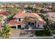 Luxury home with red tile roof; expansive backyard and pool at 8913 Canyon Springs Dr, Las Vegas, NV 89117