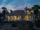 Luxury home with pool and spa at dusk; expansive backyard at 8913 Canyon Springs Dr, Las Vegas, NV 89117