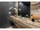 Elegant bathroom with onyx sink and modern fixtures at 8913 Canyon Springs Dr, Las Vegas, NV 89117