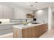 Modern kitchen with large island and white cabinets at 8913 Canyon Springs Dr, Las Vegas, NV 89117