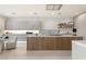 Modern kitchen with sleek cabinetry, large island, and high-end appliances at 8913 Canyon Springs Dr, Las Vegas, NV 89117