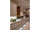 Modern kitchen with hidden pantry and under cabinet lighting at 8913 Canyon Springs Dr, Las Vegas, NV 89117