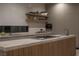 Modern kitchen island with wood countertop and gas cooktop at 8913 Canyon Springs Dr, Las Vegas, NV 89117