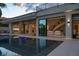 Luxury pool with expansive view of home's interior at 8913 Canyon Springs Dr, Las Vegas, NV 89117