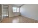 Spacious bedroom with wood floors and access to a balcony at 8945 Clairton Ct, Las Vegas, NV 89117