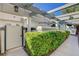 Townhome entryway with pergola, landscaping, and walkway at 8945 Clairton Ct, Las Vegas, NV 89117