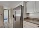 Stainless steel refrigerator in kitchen with granite countertops at 8945 Clairton Ct, Las Vegas, NV 89117