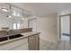 Kitchen with stainless steel dishwasher and granite countertops at 8945 Clairton Ct, Las Vegas, NV 89117