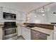 Modern kitchen with stainless steel appliances and granite countertops at 8945 Clairton Ct, Las Vegas, NV 89117