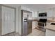 Kitchen with stainless steel appliances and white cabinets at 8945 Clairton Ct, Las Vegas, NV 89117