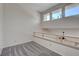 Bright loft bedroom with grey carpet and additional windows at 8945 Clairton Ct, Las Vegas, NV 89117