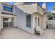 Private patio with white wicker chair and sliding glass door at 8945 Clairton Ct, Las Vegas, NV 89117