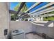 Private patio with air conditioning unit and pergola at 8945 Clairton Ct, Las Vegas, NV 89117