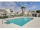 Inviting community pool with surrounding lounge chairs at 8945 Clairton Ct, Las Vegas, NV 89117