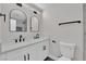 Stylish bathroom with double vanity and arched mirrors at 905 Antelope Way, Las Vegas, NV 89145