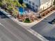 Community entrance view with a pool and landscaping at 9113 Harvest Homes St, Las Vegas, NV 89123