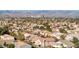 Aerial view of a residential neighborhood with mountain views at 9113 Harvest Homes St, Las Vegas, NV 89123