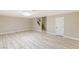 Finished basement with wood-look floors, stairs, and storage room at 9113 Harvest Homes St, Las Vegas, NV 89123