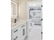 Modern bathroom with white cabinets, quartz countertop, and a walk-in shower at 9113 Harvest Homes St, Las Vegas, NV 89123