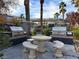 Community BBQ area with tables and benches near pool at 950 Seven Hills Dr # 2413, Henderson, NV 89052