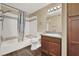 Bathroom with granite vanity and bathtub/shower combo at 950 Seven Hills Dr # 2413, Henderson, NV 89052