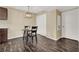 Small dining area with dark wood floors and modern light fixture at 950 Seven Hills Dr # 2413, Henderson, NV 89052